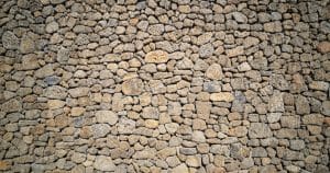 Read more about the article Elevate Your Landscape: Transforming Terrain with Boulder Wall Designs